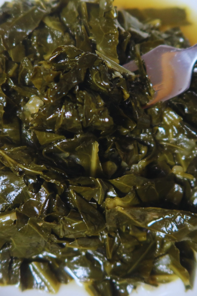 a photo of collard greens with a silver fork