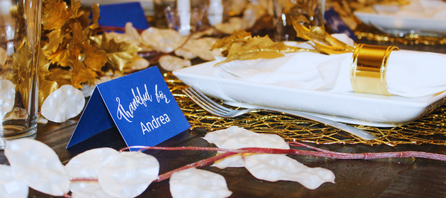 a photo of a name card and gold decorations